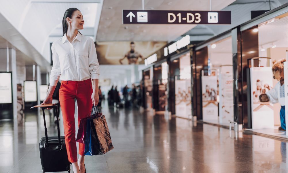 Protect Valuables While Traveling Woman At Airport Hoopla