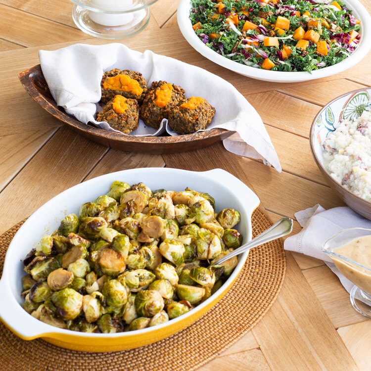 Give thanks and gratitude while also taking the stress out of cooking, with a plant-based Thanksgiving from Café Gratitude. Enjoy items like these Maple Miso Brussels Sprouts.
