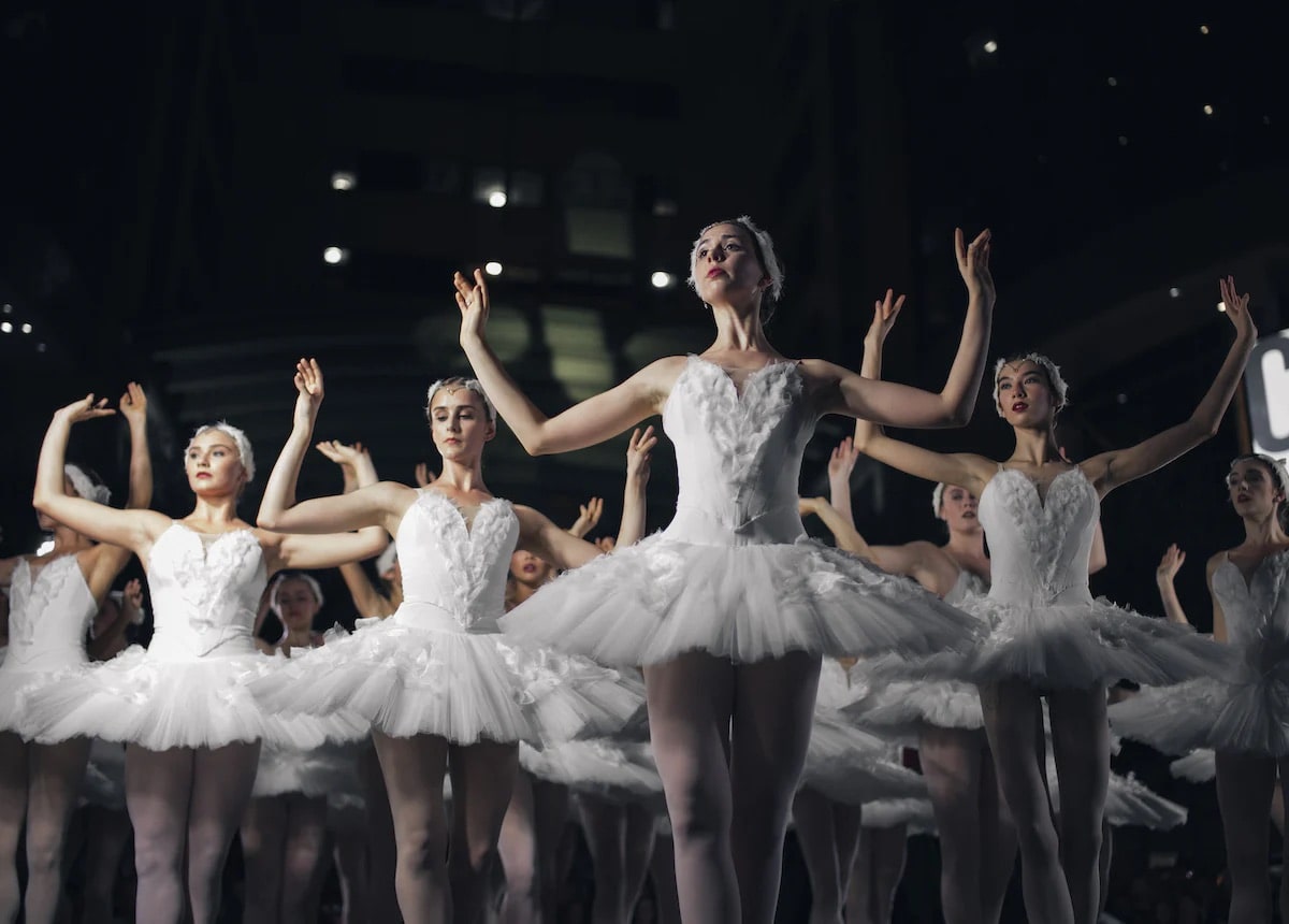 An image of several female ballerinas on stage.