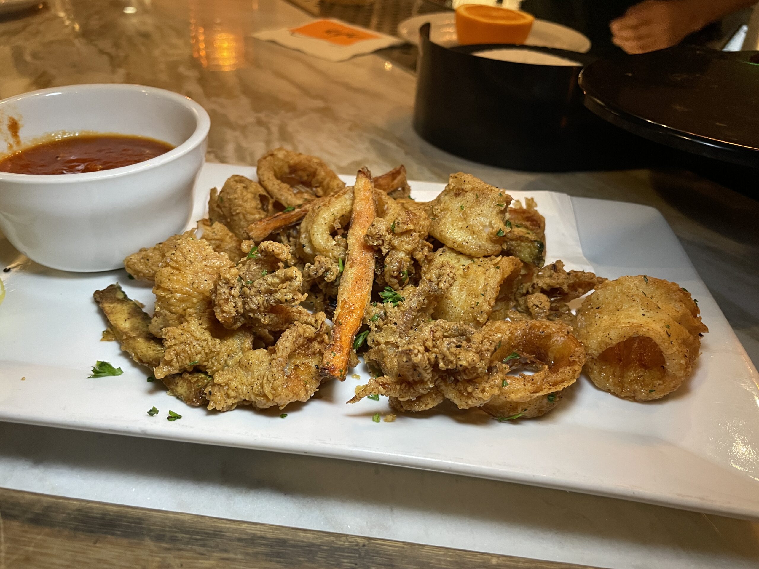 Located next door to Ugo, Culver City's beloved neighborhood Italian restaurant sits The Lounge at Ugo, an intimate, elevated social gathering space offering craft cocktails and sharable plates, like this mouthwatering Calamari.