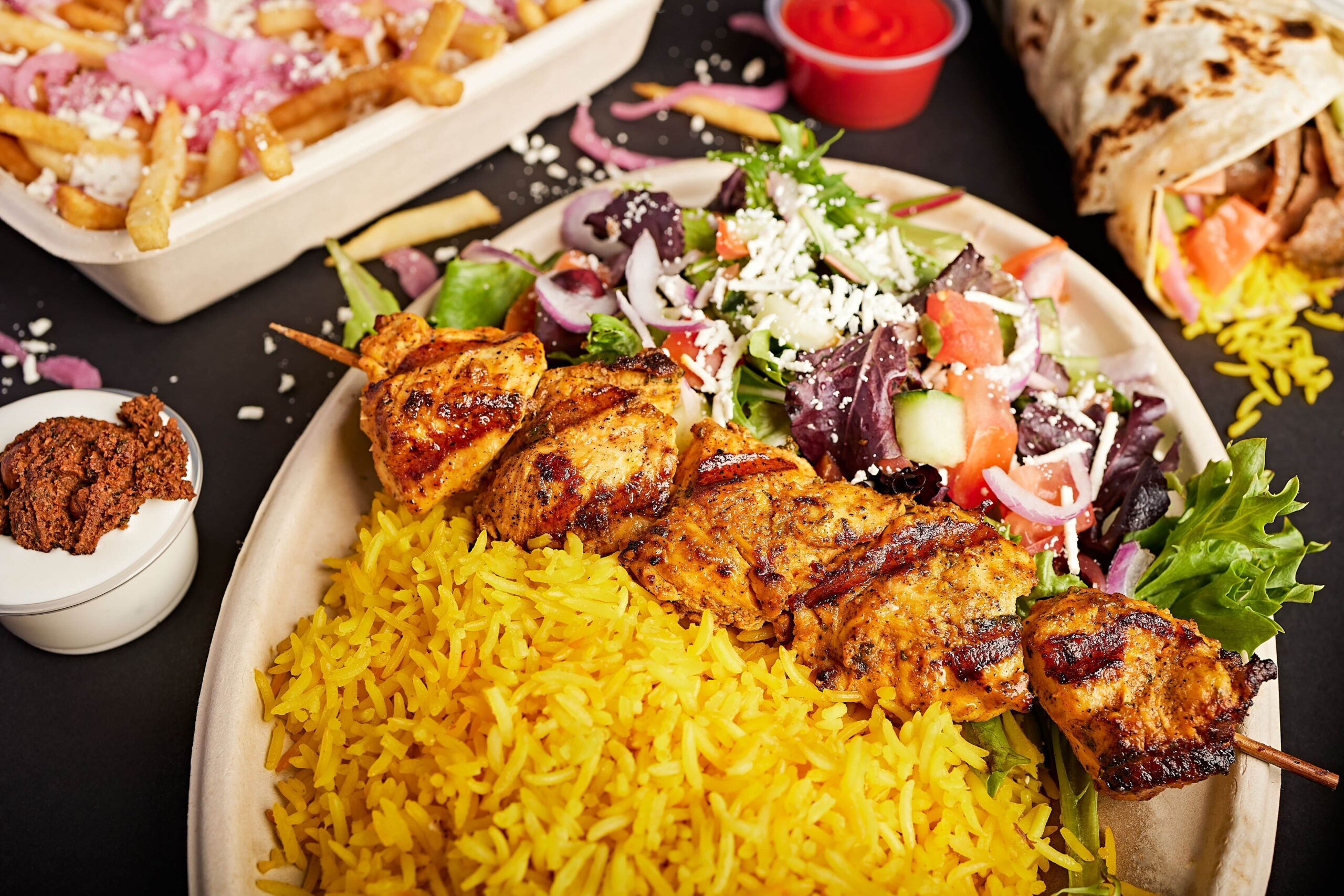 SoCal-based, fast-casual Mediterranean eatery The Kebab Shop is now open in El Segundo. The menu features bites like the customizable, refreshing Plates atop fragrant Saffron Rice.