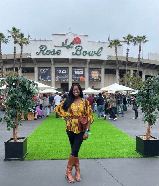 A photo of Ariel standing outside the Rose Bowl for at the 2022 Masters of Taste premier outdoor luxury food and beverage festival.