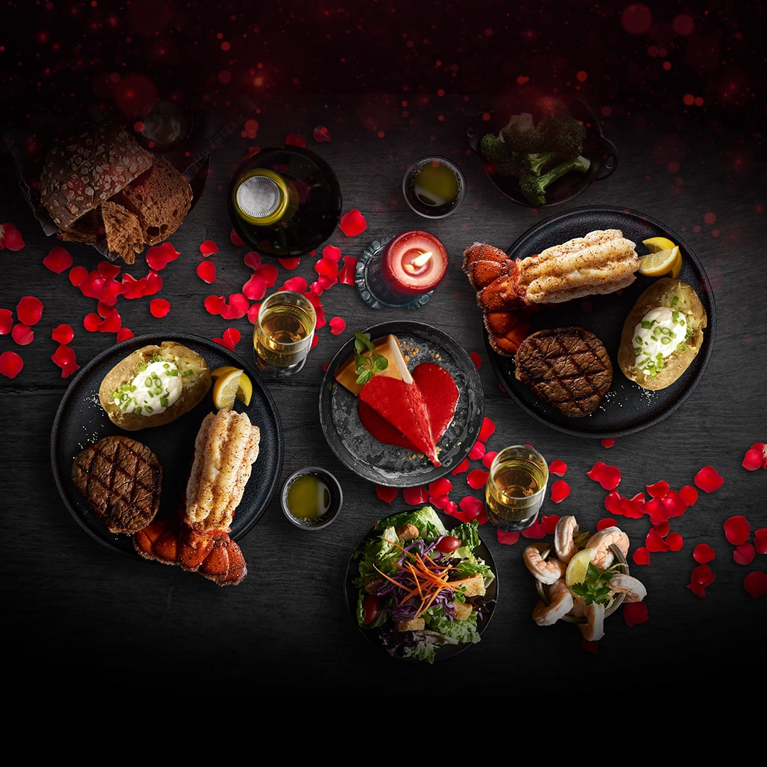A photo of Black Angus Valentine's Day spread with filets and lobster tails.