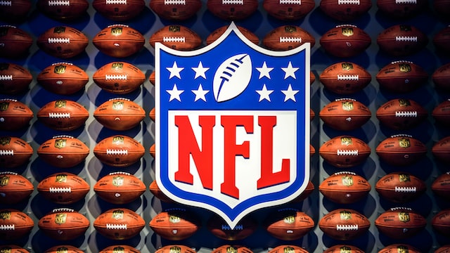 A photo of an NFL football display with footballs.
