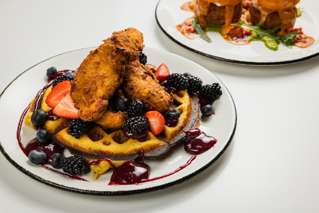 A photo of the Wayfarer brunch item Chimichurri Chicks ‘N Waffle.