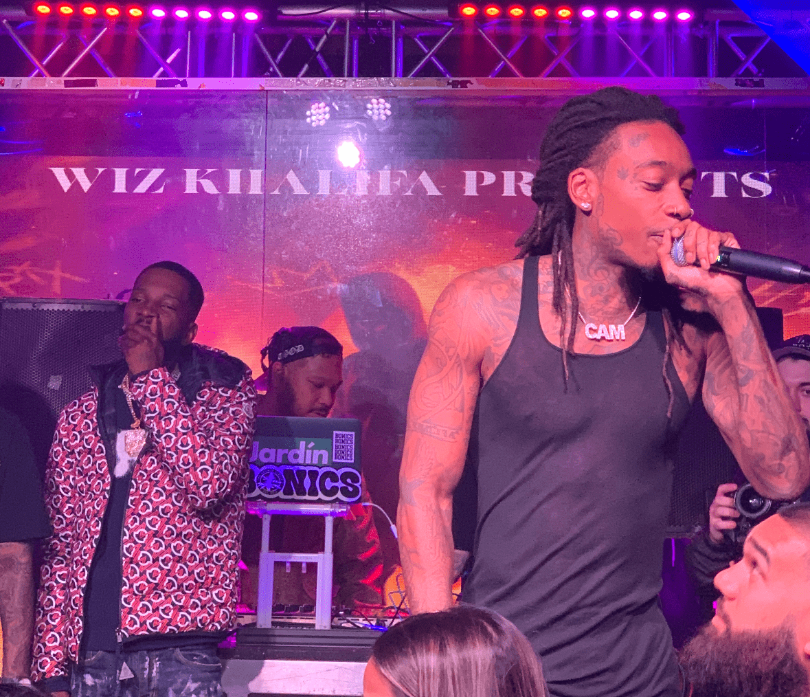 A photo of rapper Wiz Khalifa live on stage promoting his upcoming  "High School Reunion" tour.