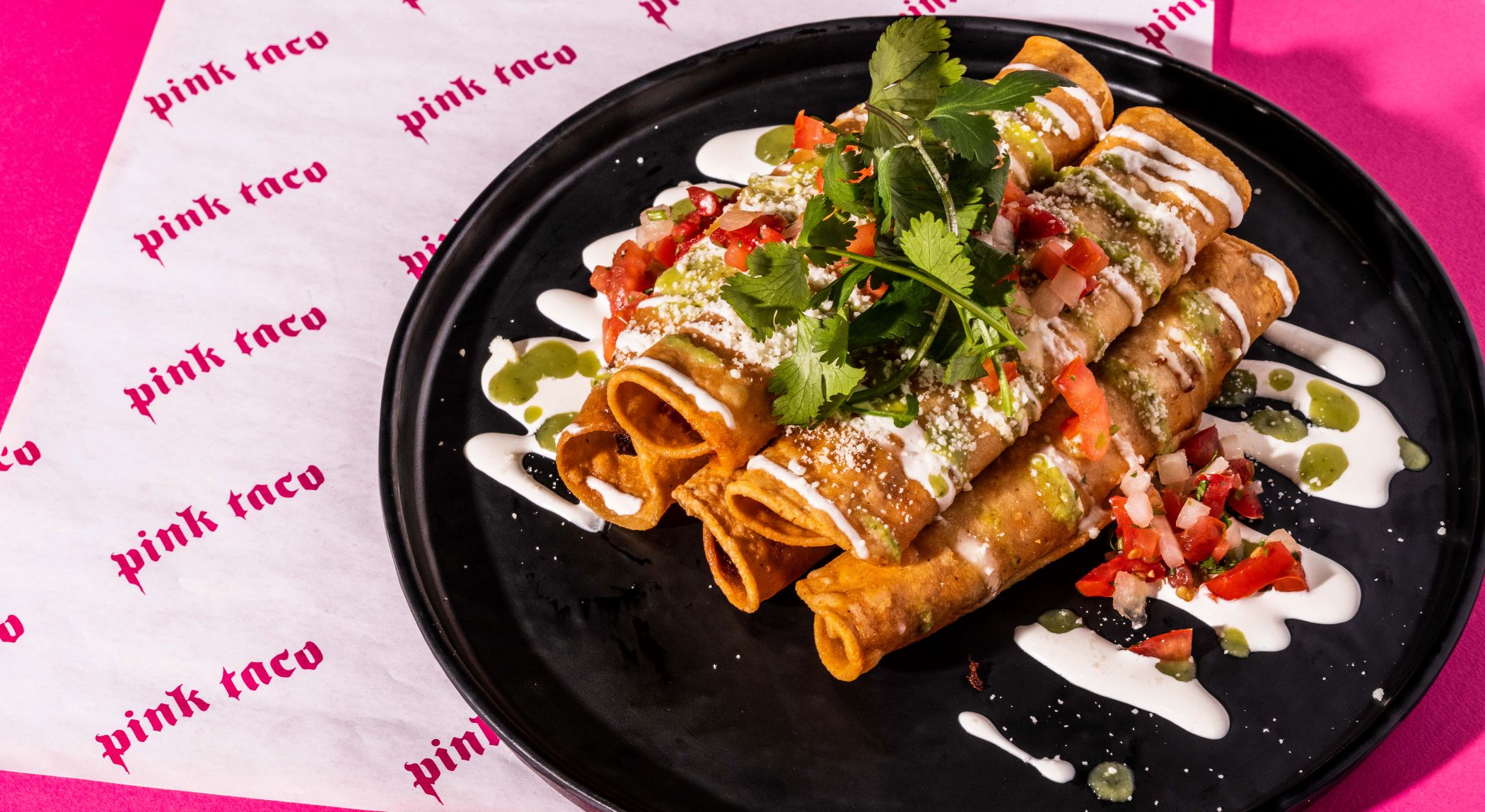 An image of the taquitos from Pink Taco.