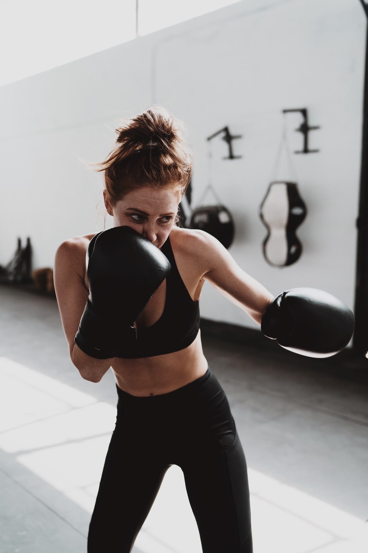 An image of a female boxer in a fight stance.