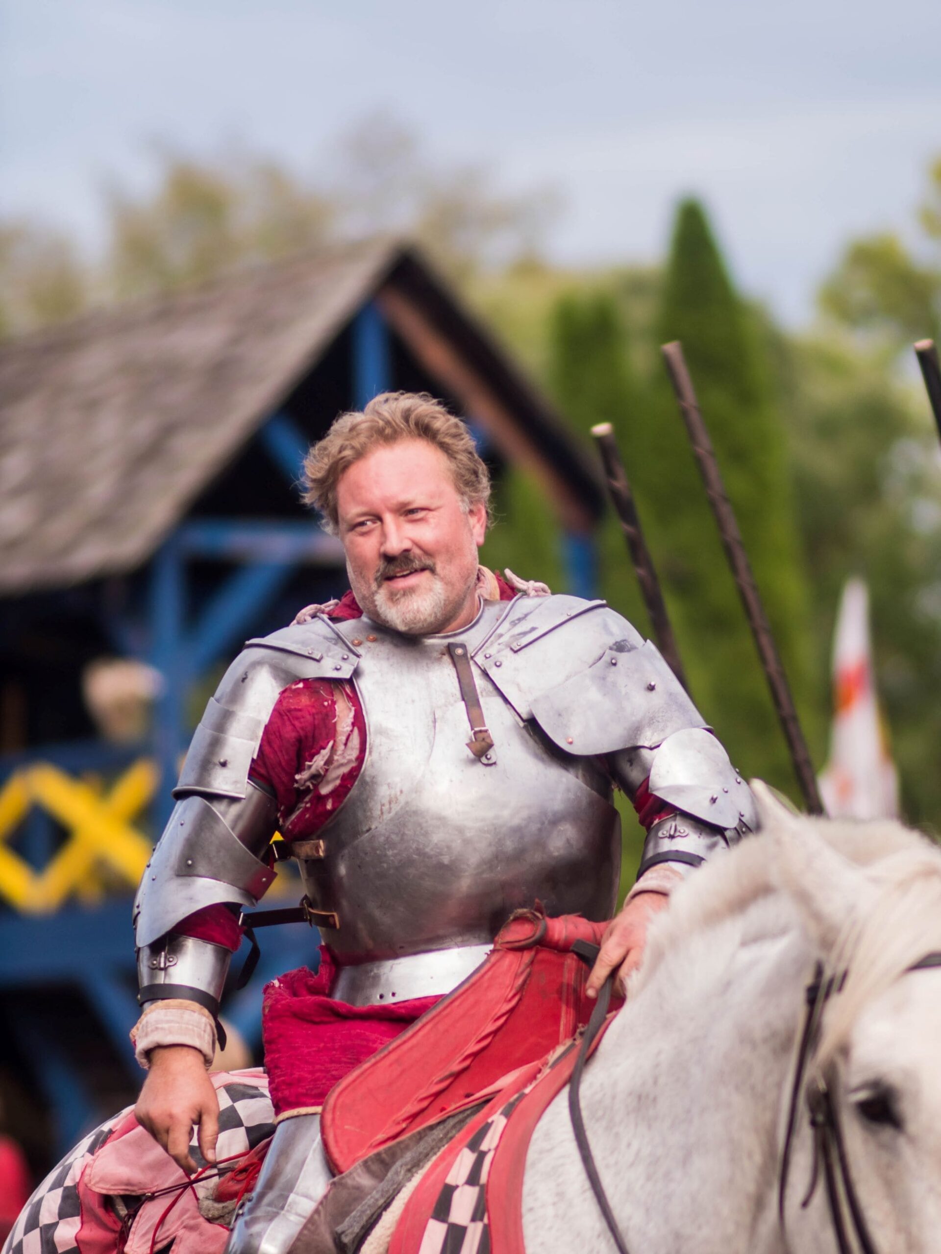An image of a man dressed as a knight on a horse at the Original Renaissance Faire.
