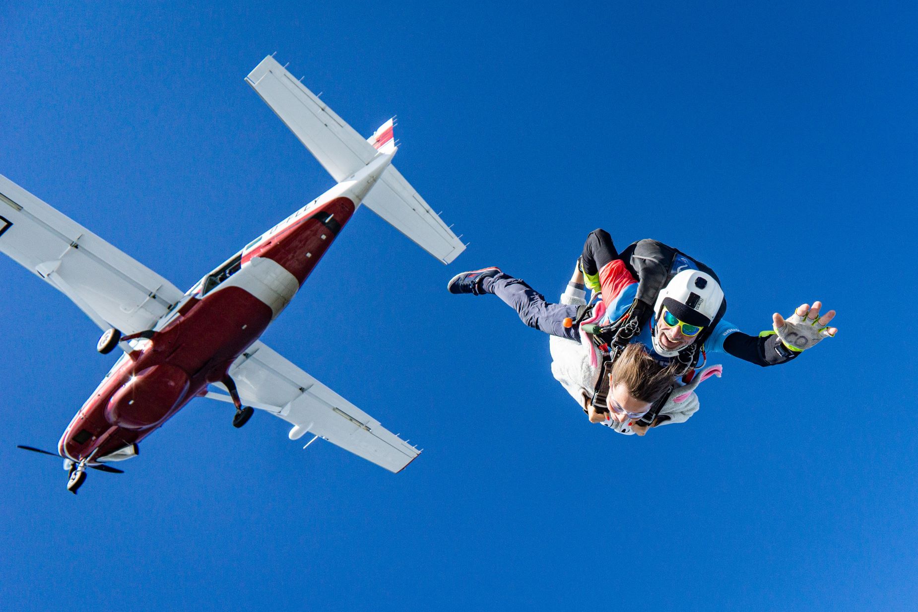 An image of tow people tandem skydiving. 