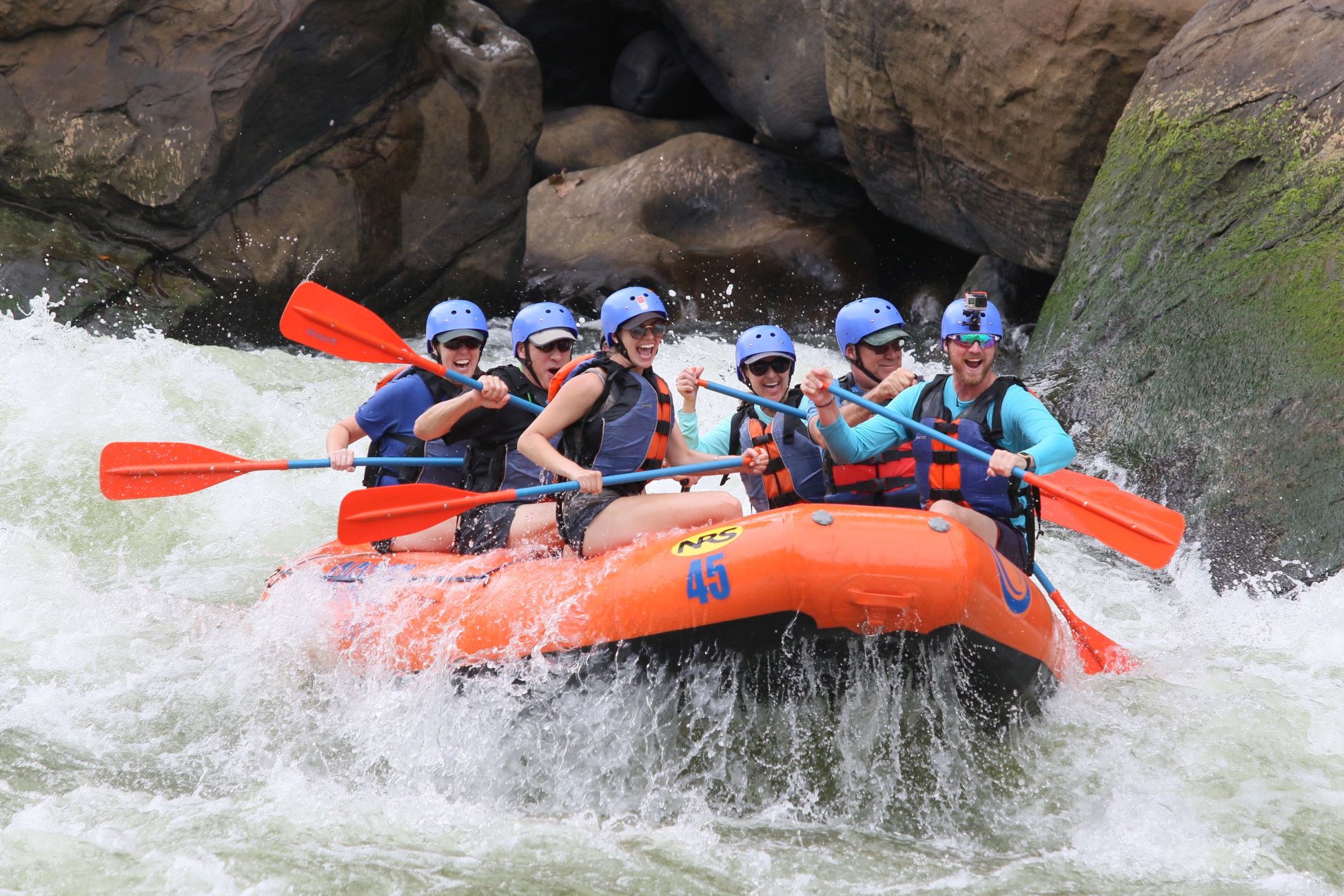 An image of people white water rafting.
