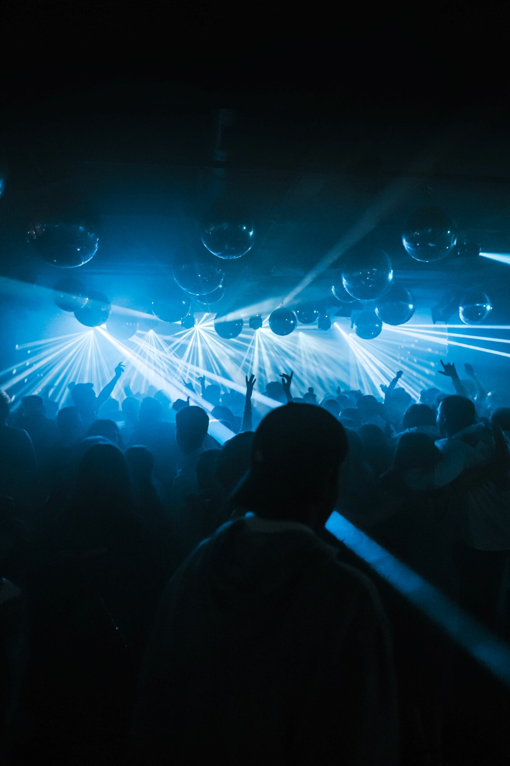 An image of people dancing at a nightclub.