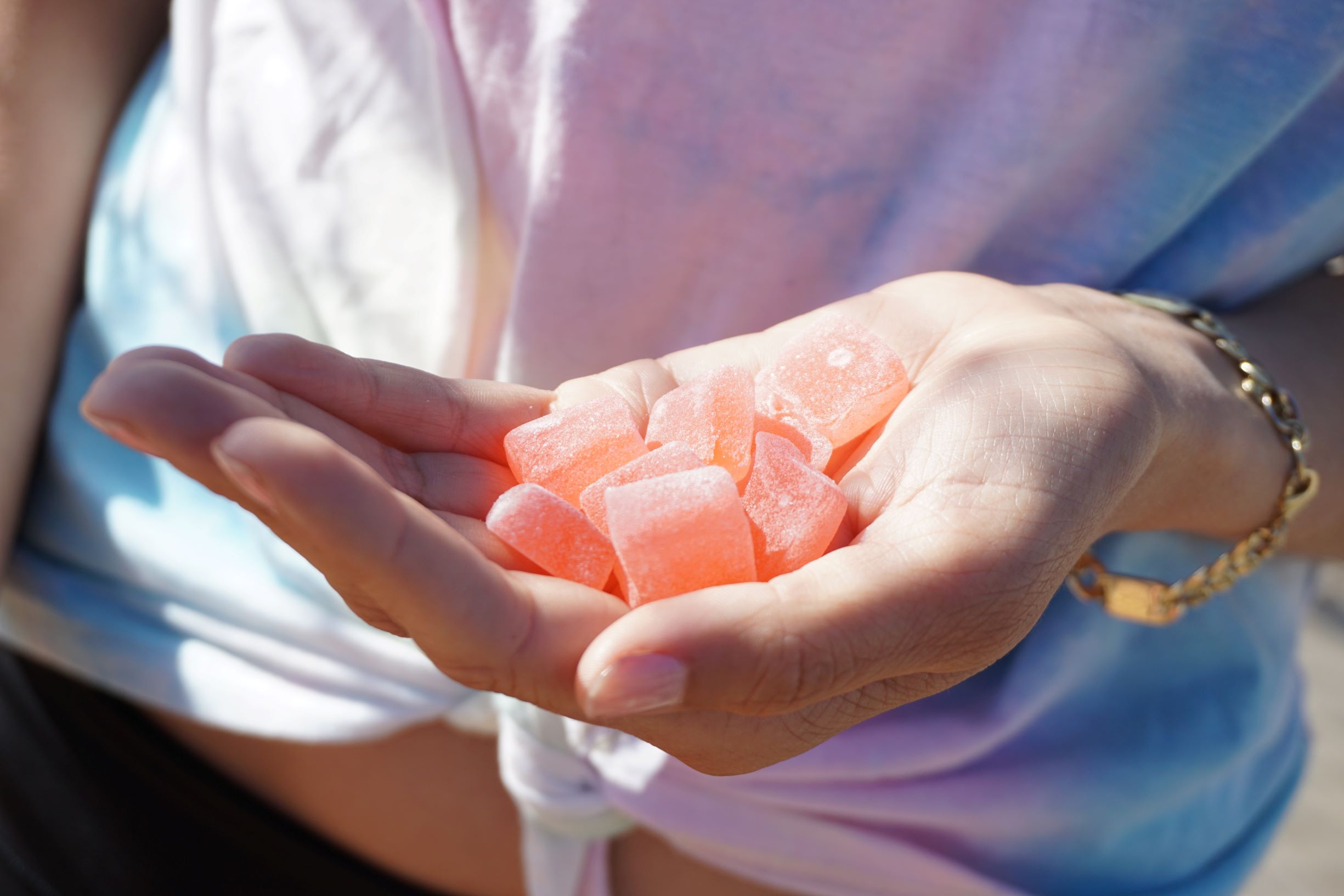 An image of someone holding sea moss gummies.