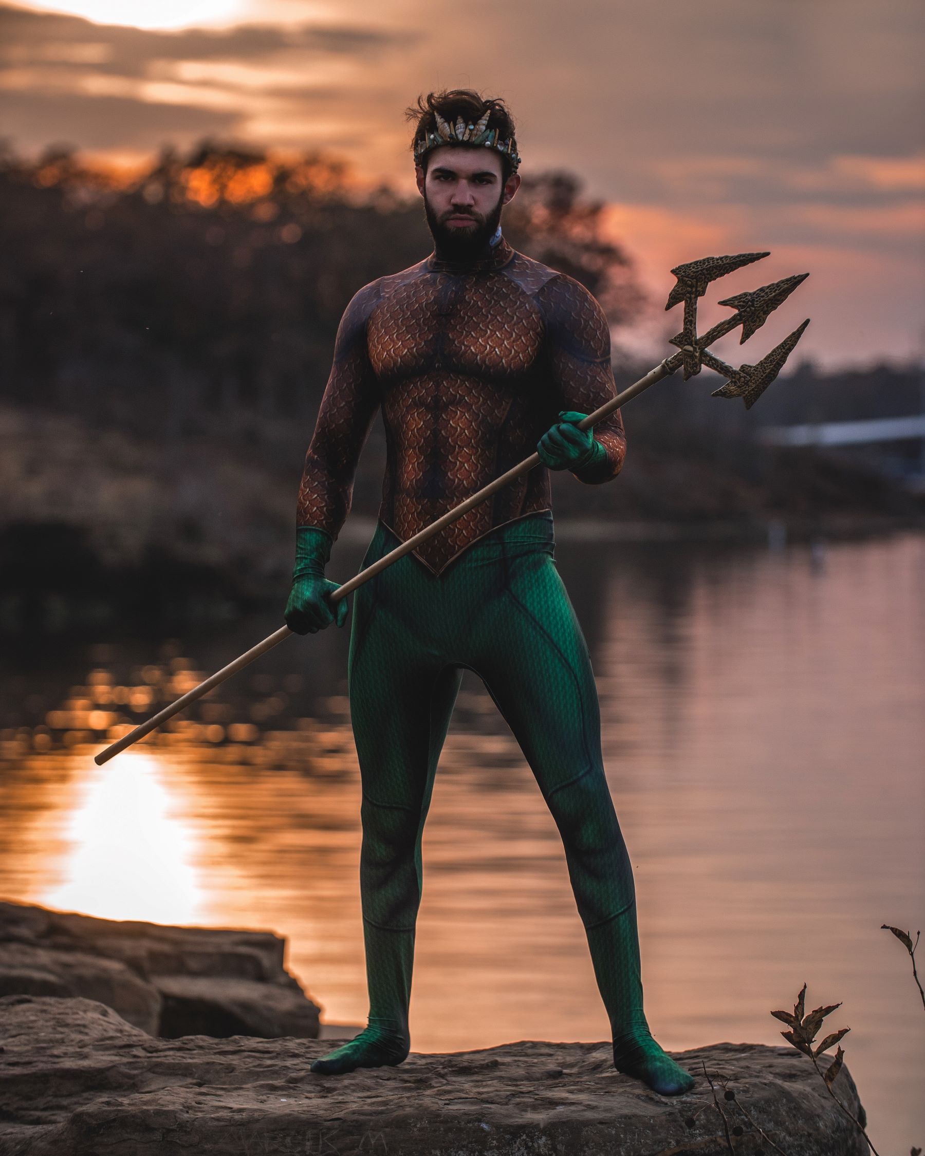 An image of a man dressed in an Aquaman costume. 