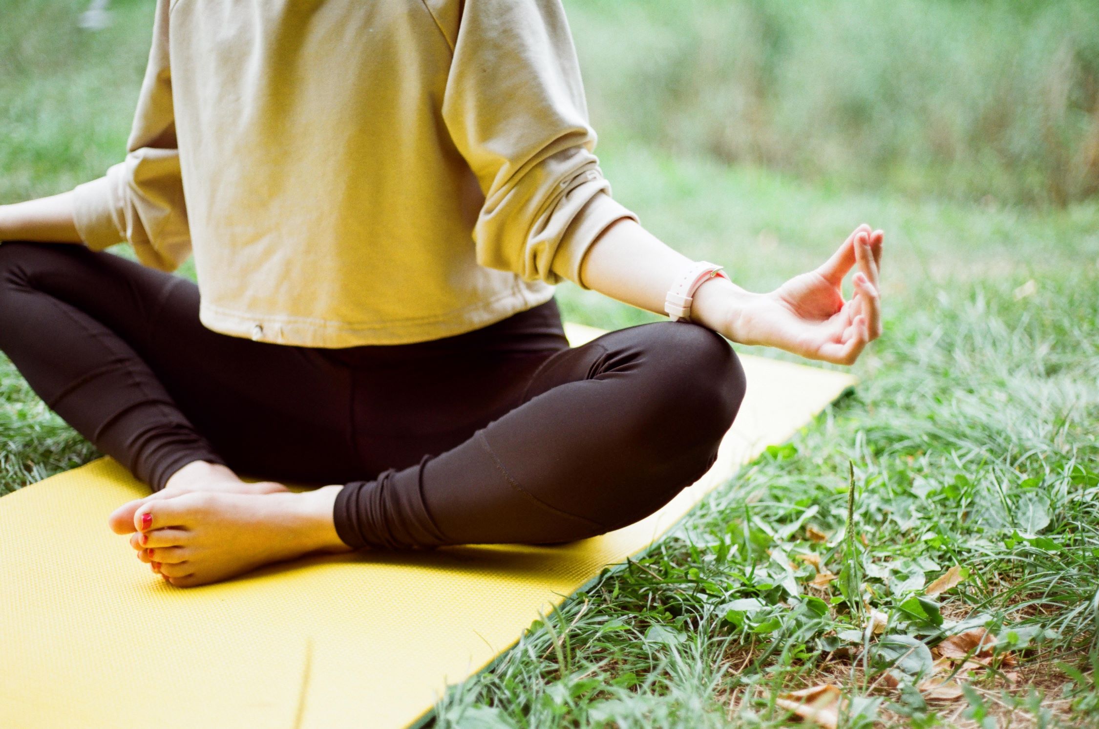 An image of a person on a yoga mat for the yoga in the park series. 