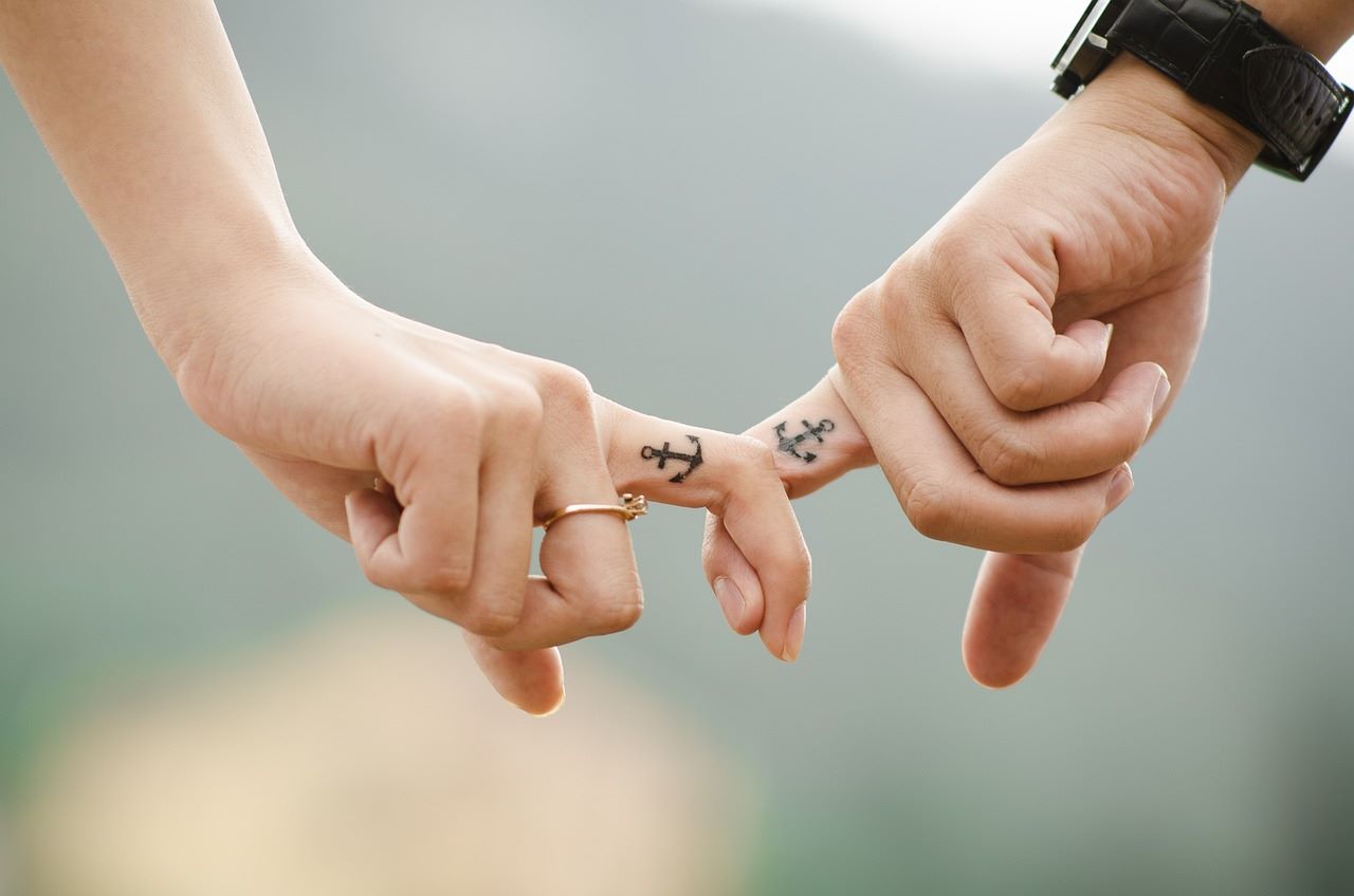 An image of two hand tattoos.