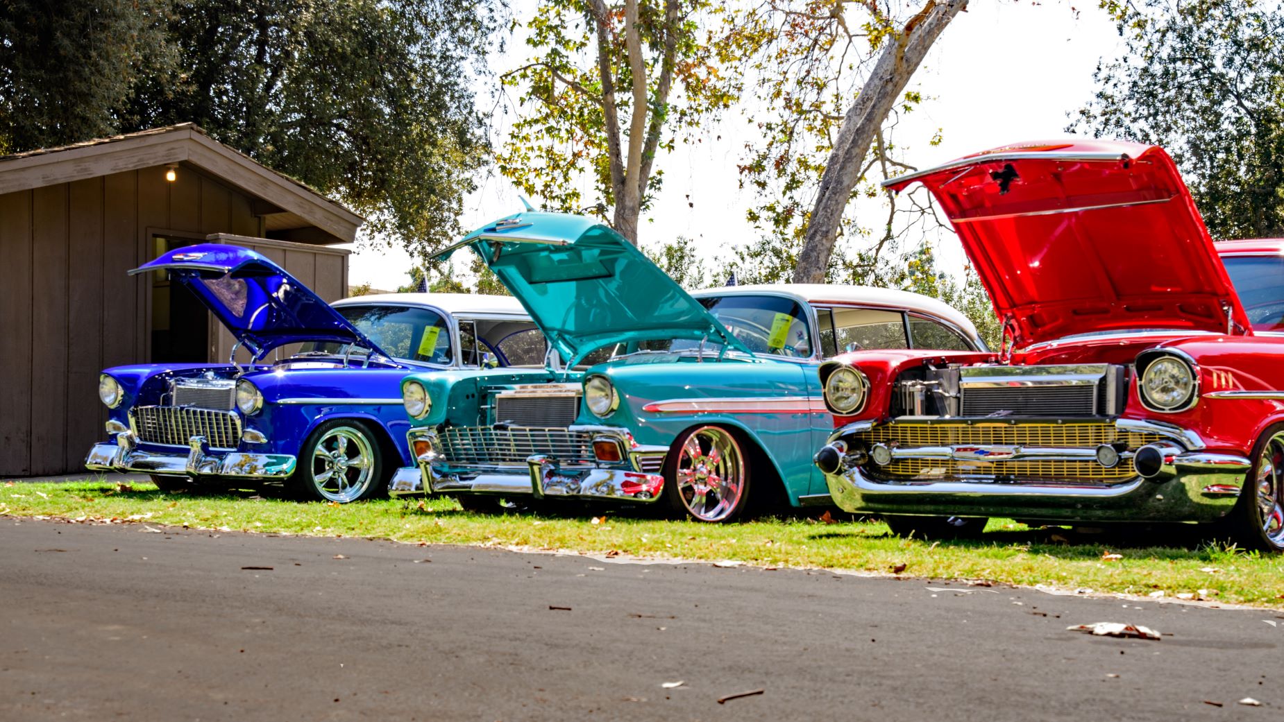 An image of three classic cars.