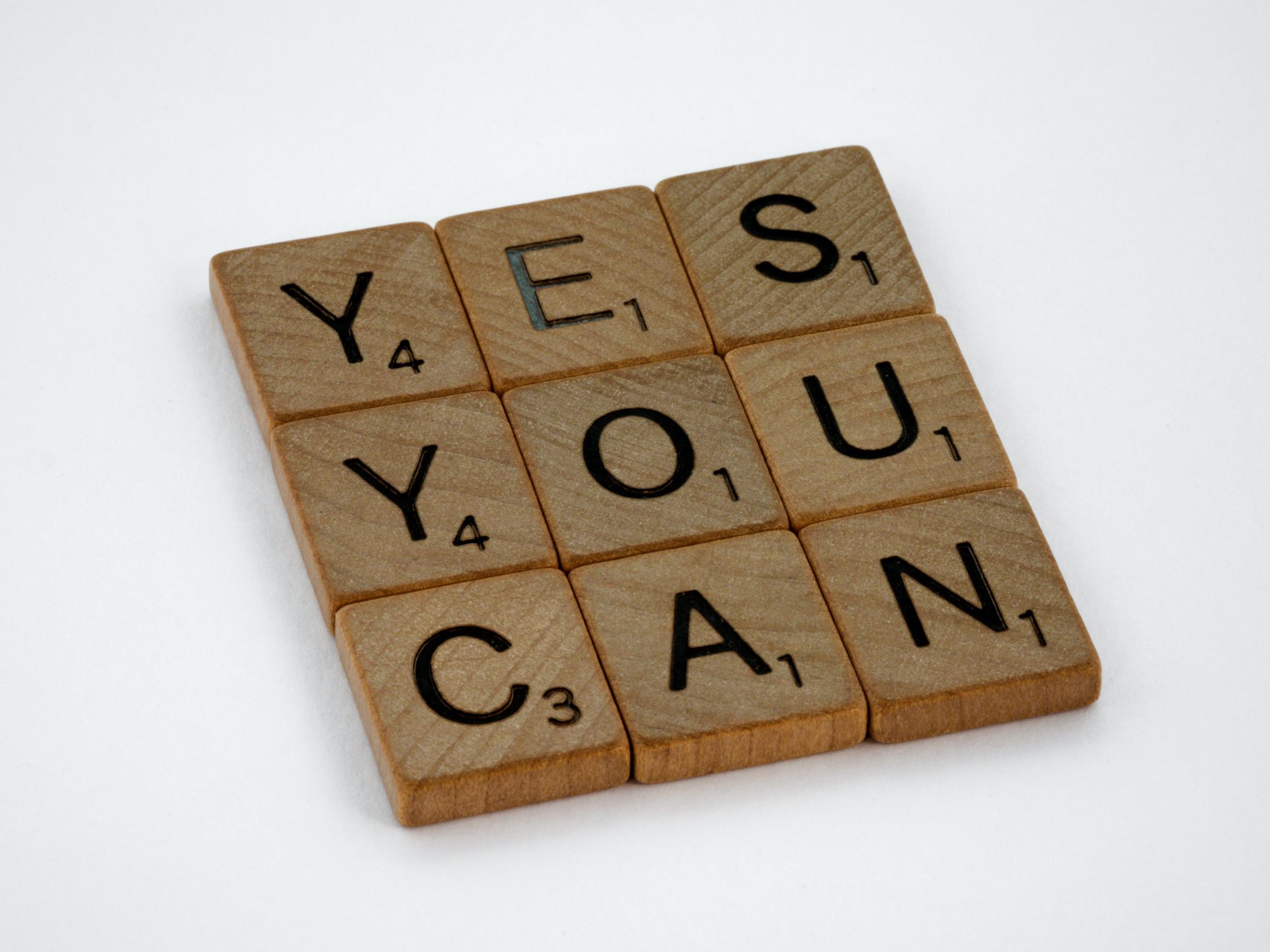 An image of tiles stating, "Yes You Can."