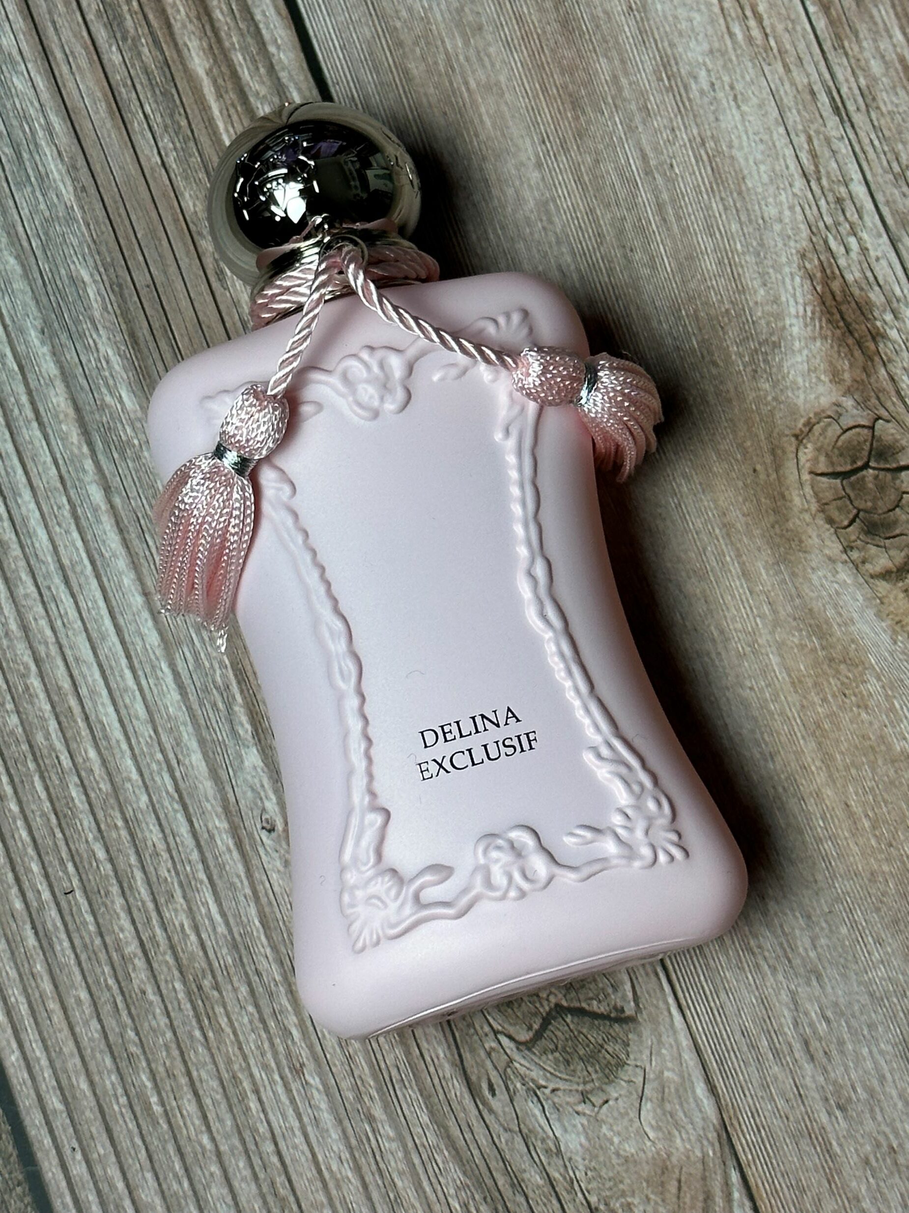 An image of a bottle of the Delina Exclusif perfume bottle. 