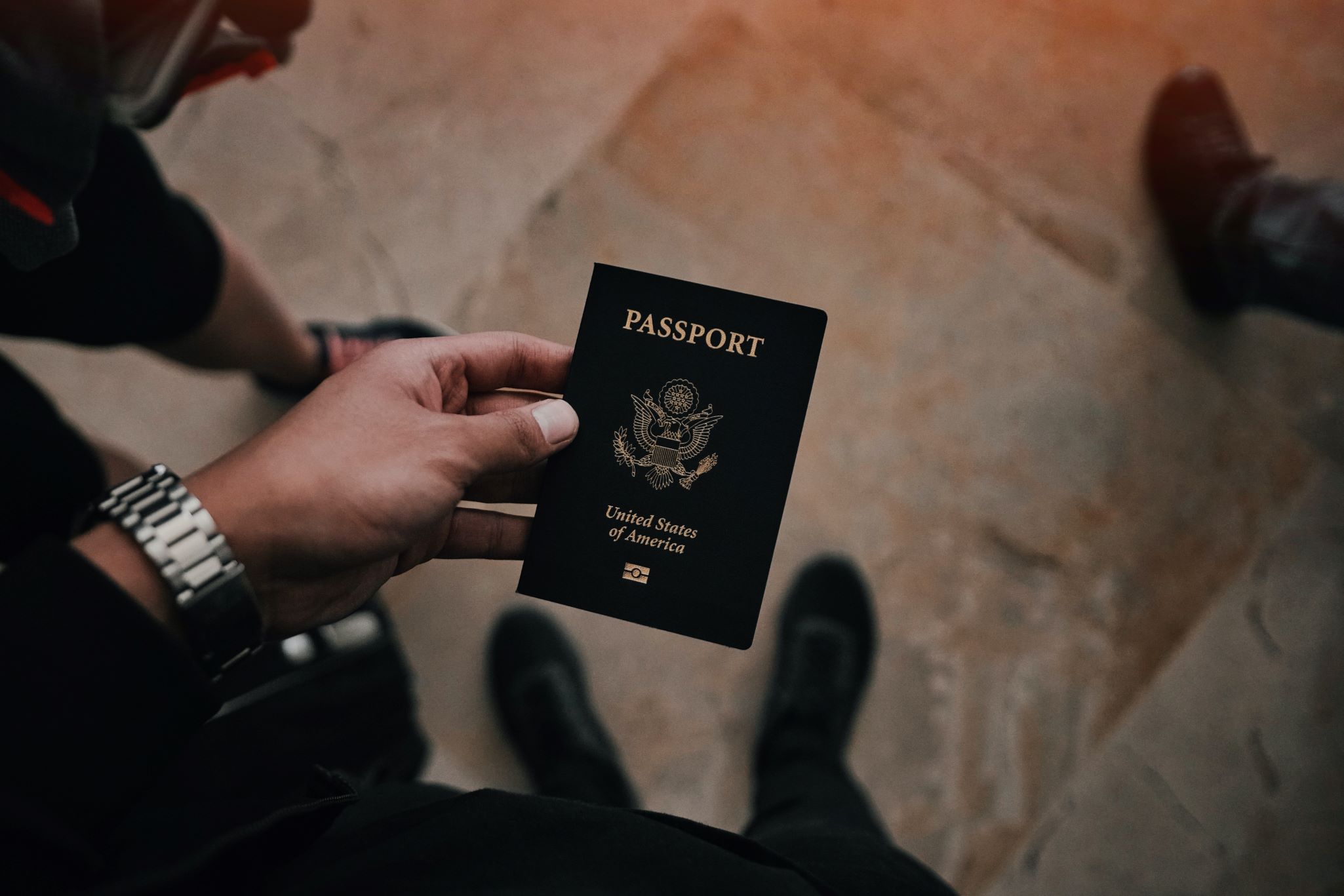 An image of a person holding a passport.