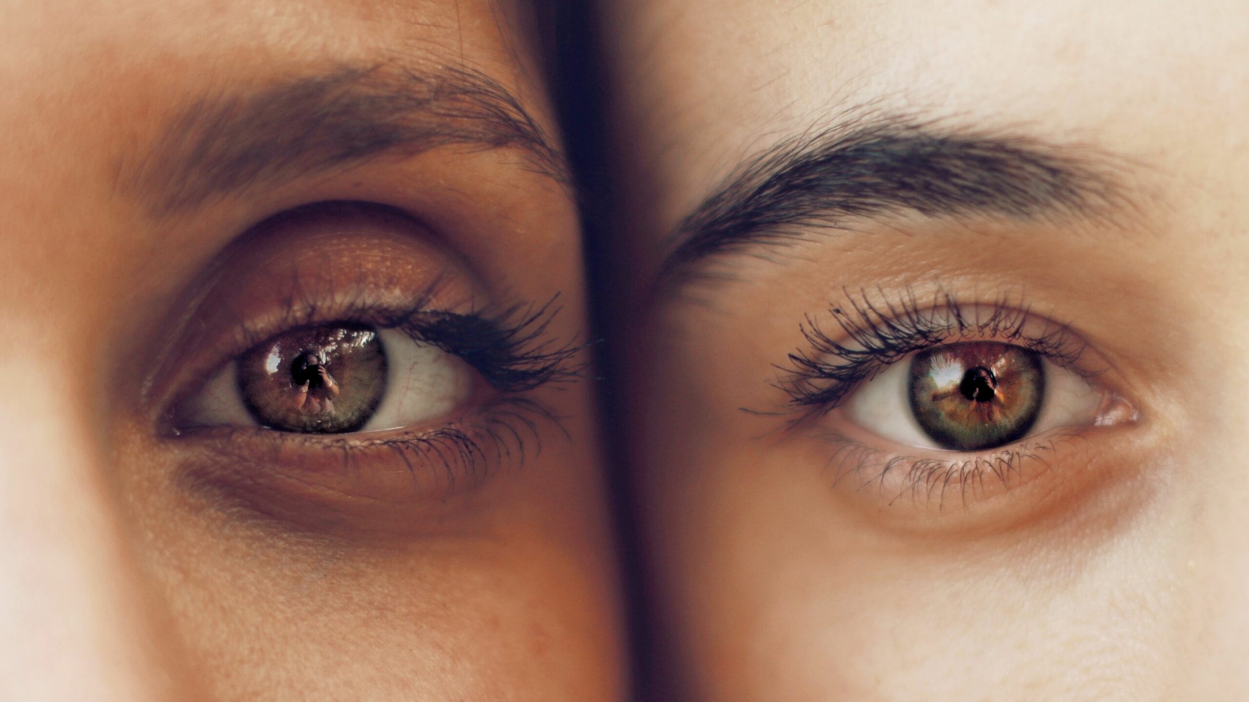 An image of two pairs of female eyes. 