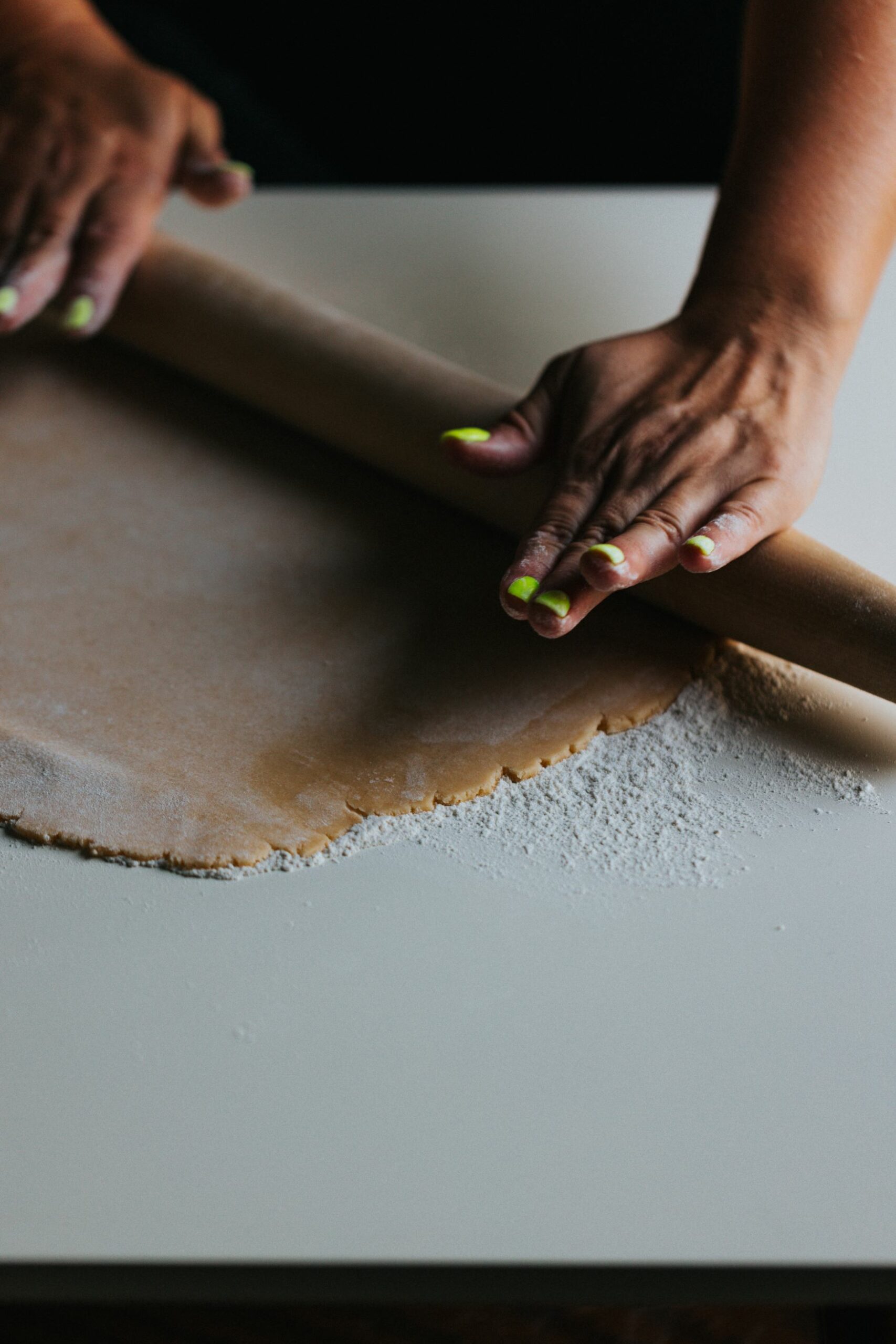 An image of someone using a rolling pin.