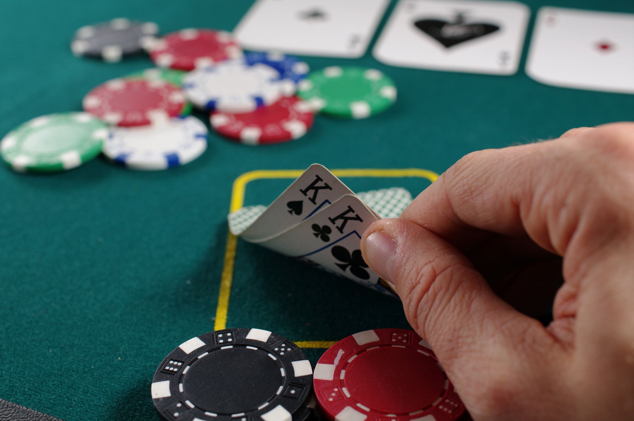 An image of someone playing poker. 