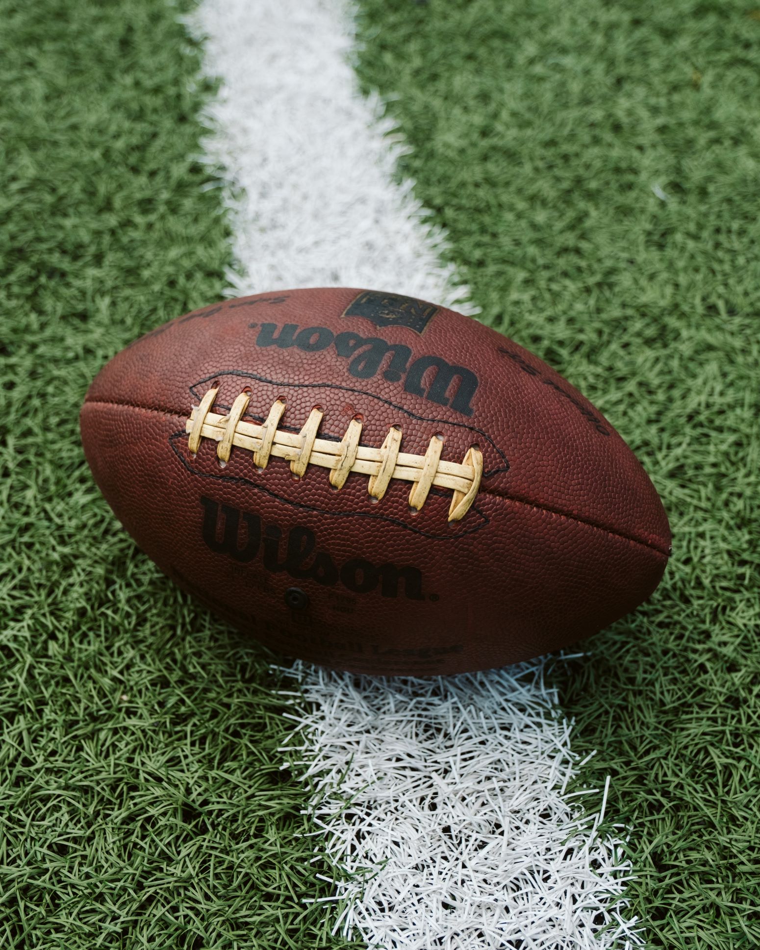 An image of a football on a football field.