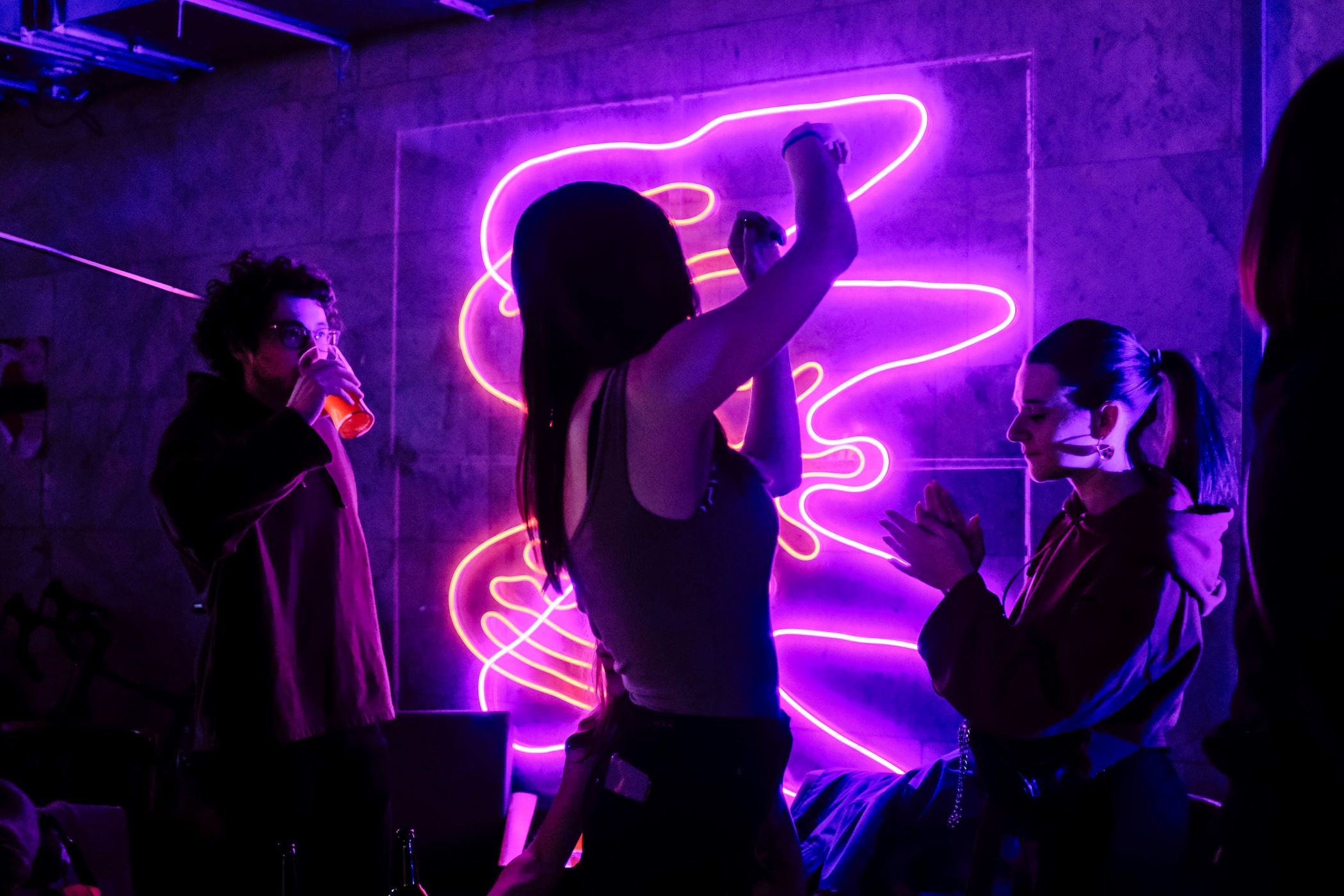 An image of a girl dancing at a nightclub.