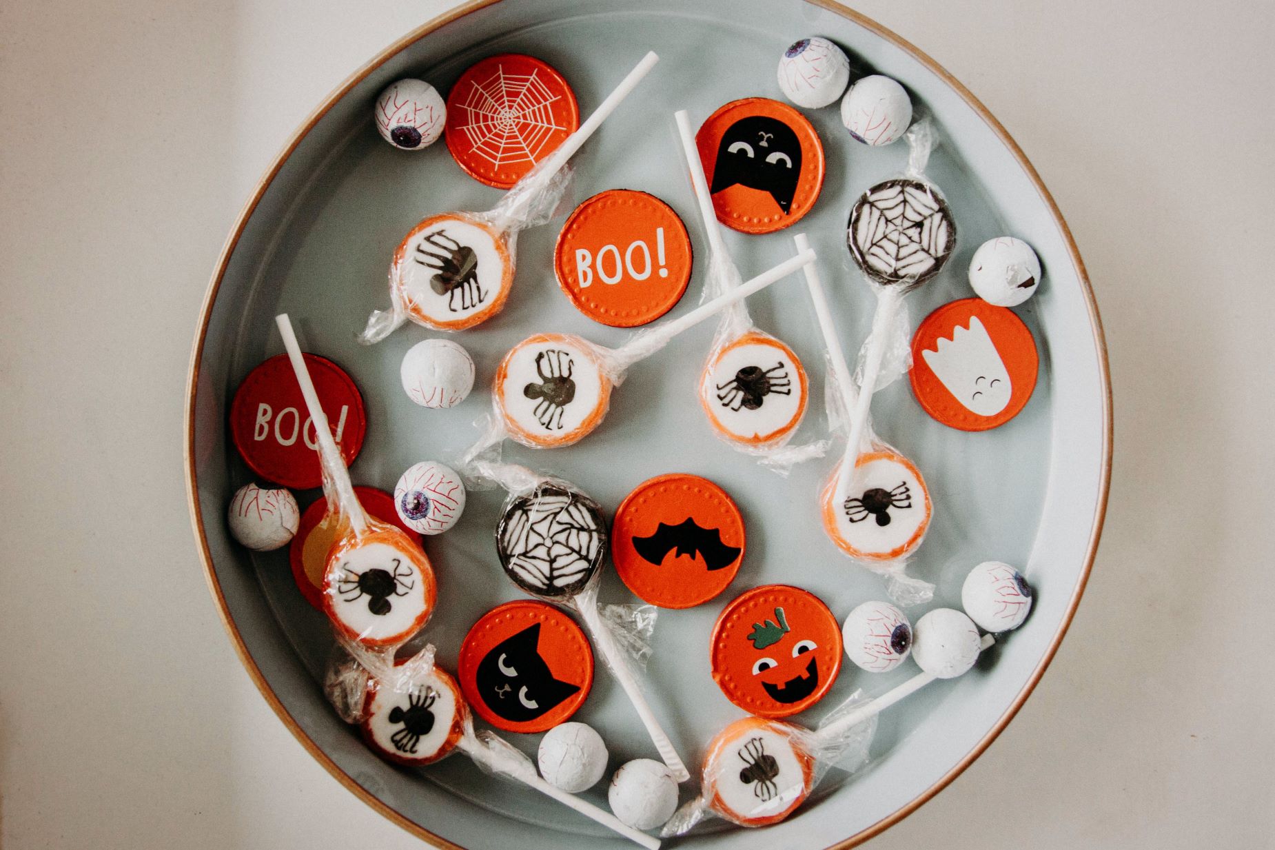 An image of Halloween cookies and lollipops. 