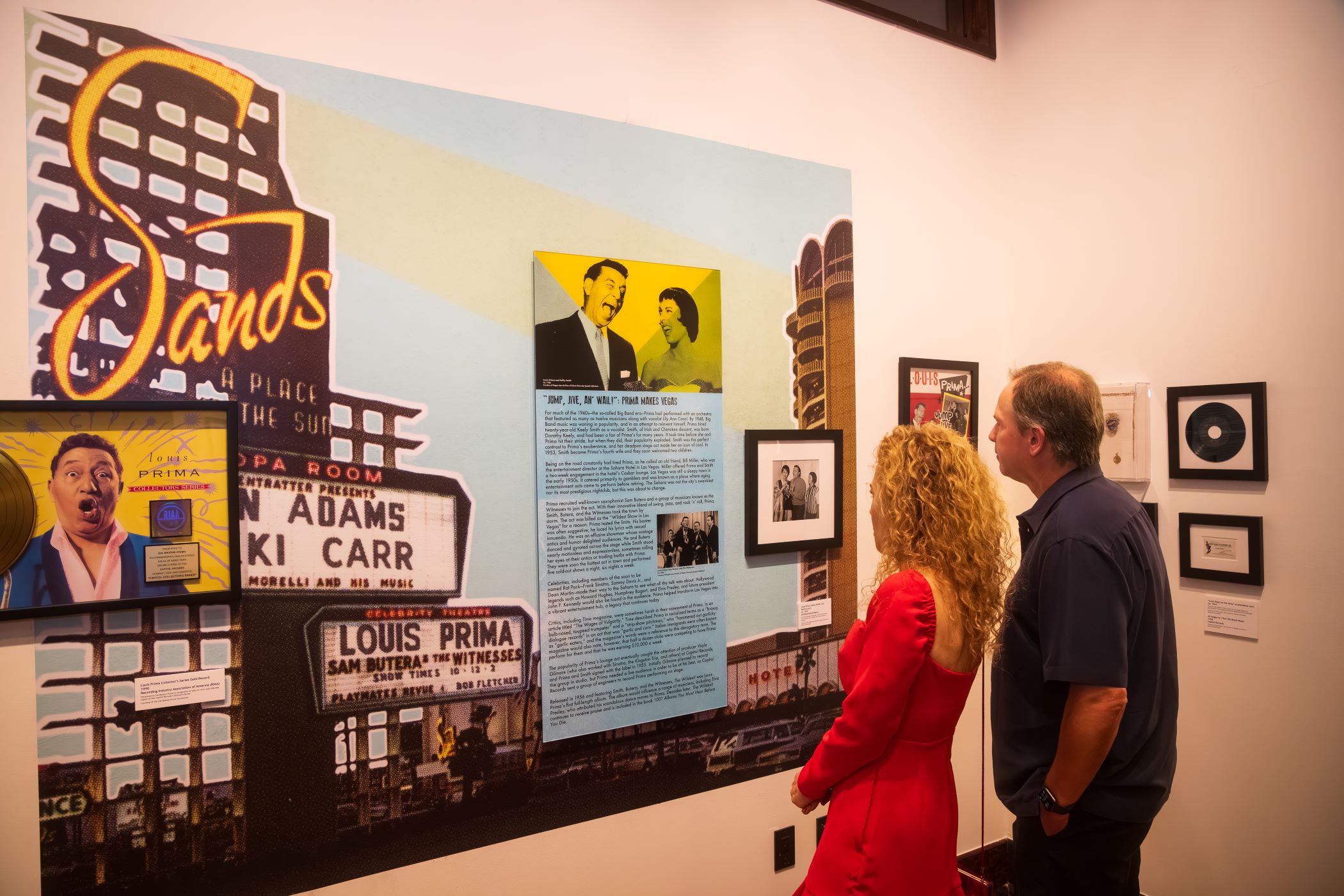 An image of spectators viewing the LA art show Louis Prima: Rediscovering a Musical Icon.