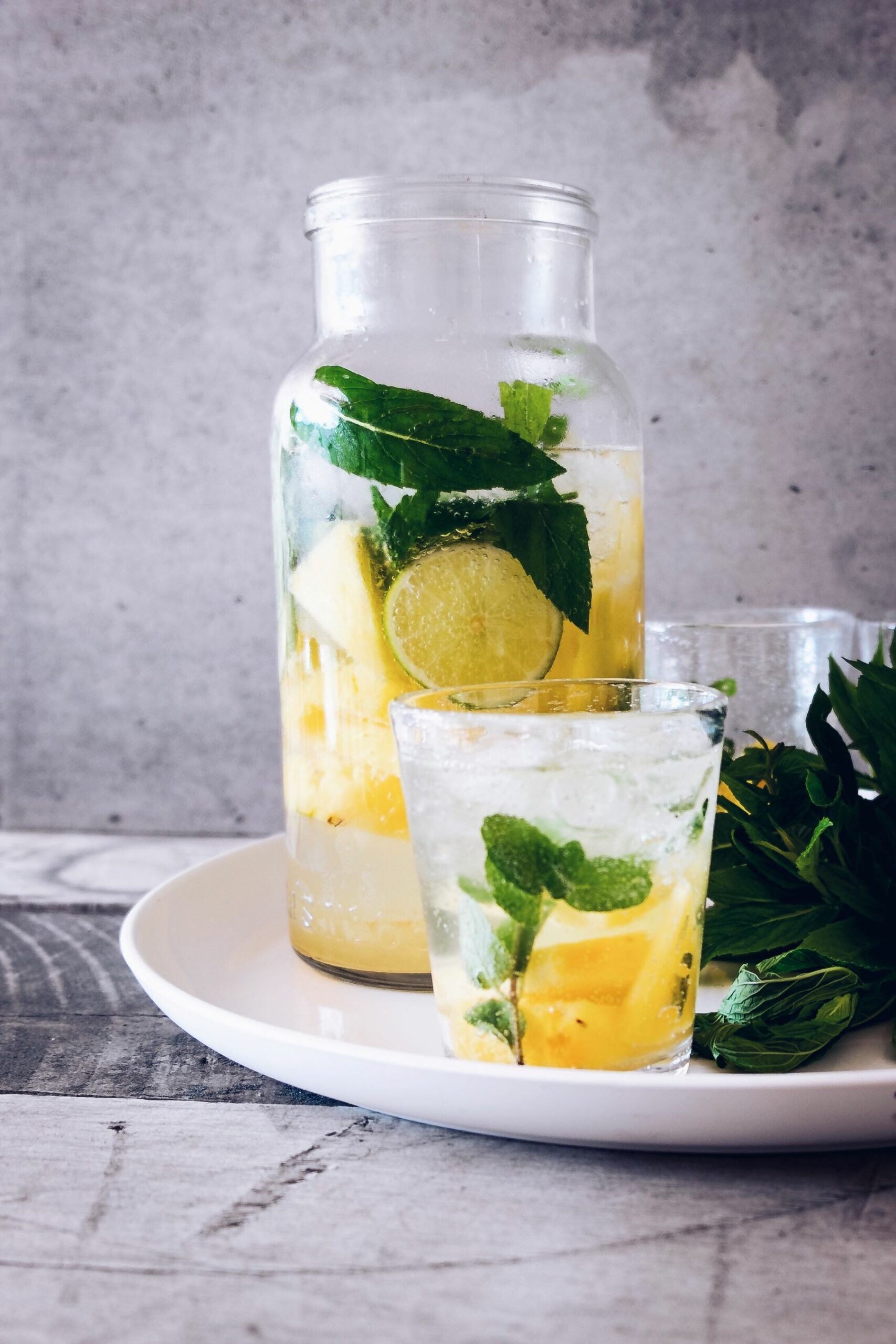 An image of a pitcher of water with lemon and mint.