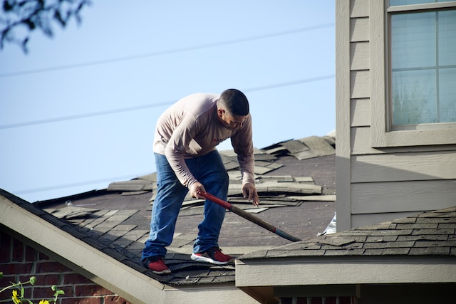 An image of a roofer working on a roof in Sherman Oaks.