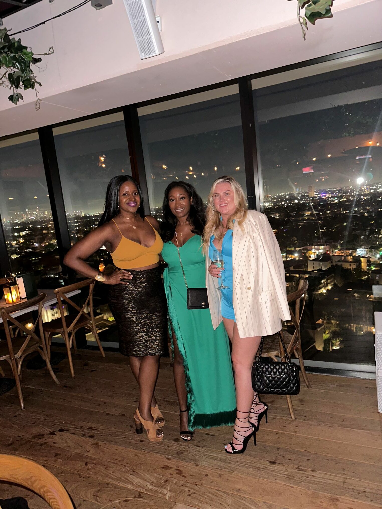 An image of three women at Harriet's rooftop.