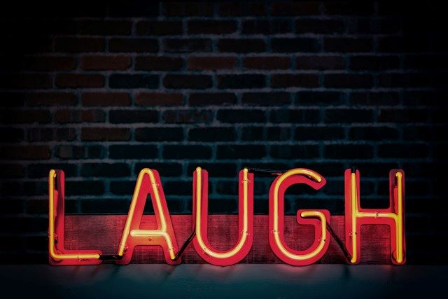 An image of the word 'Laugh.'