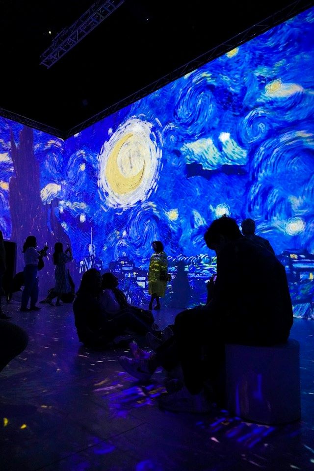 An image of people at the Van Gogh: The Immersive Experience.