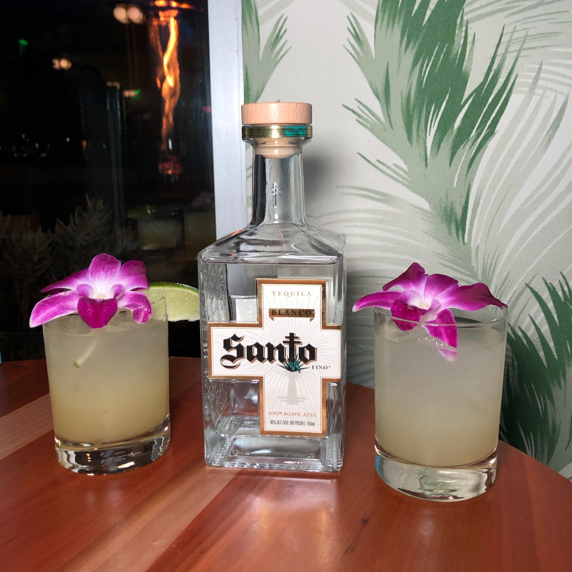 An image of a bottle of Santo Tequila and two Smoky Santo Margaritas at the Santo tequila tasting with Guy Fieri.