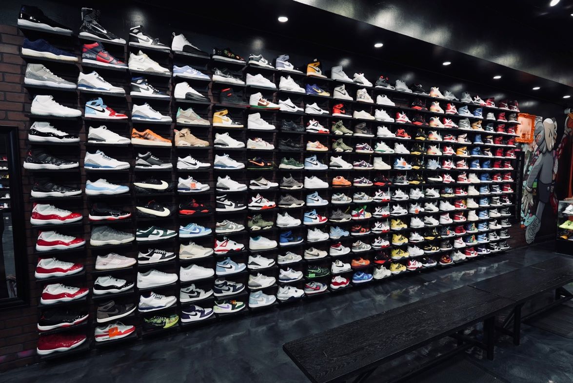 An image of a wall of sneakers at Coolkicks.