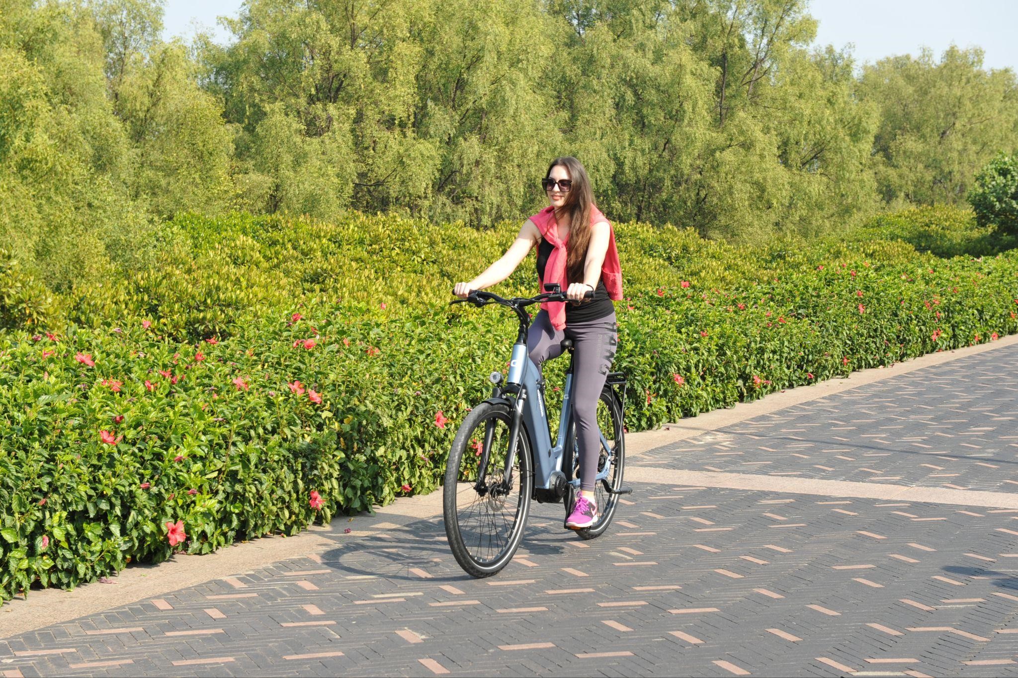 An image of a woman riding an e-bike.