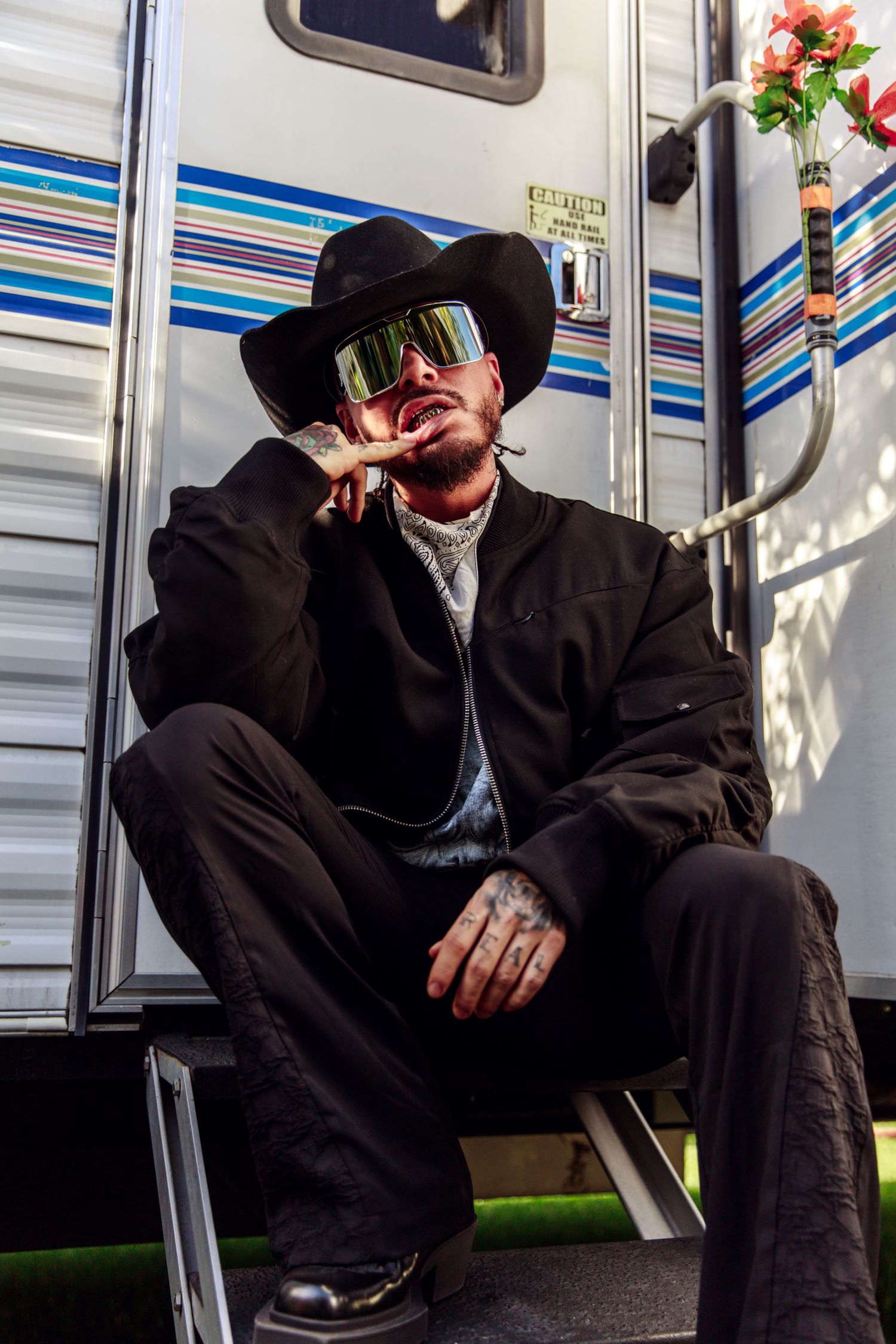An image of J Balvin outside his trailer at Coachella.