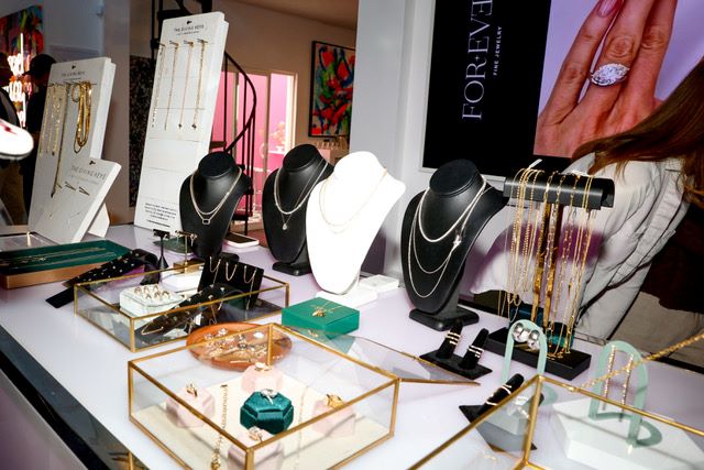 An image of the display for For Ever Fine Jewelry and The Giving Keys jewelry.