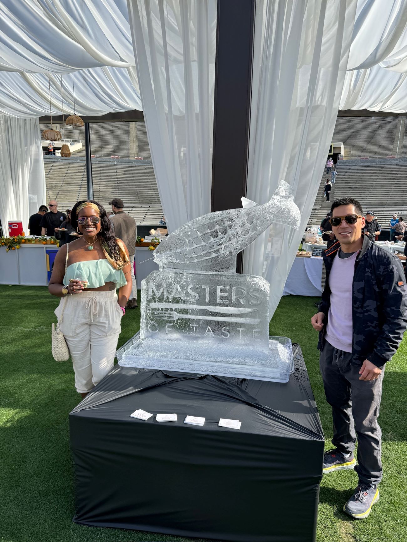 An image of lifestyle blogger Ariel and guest blogger E-Kan Soong posing next to an ice luge. 