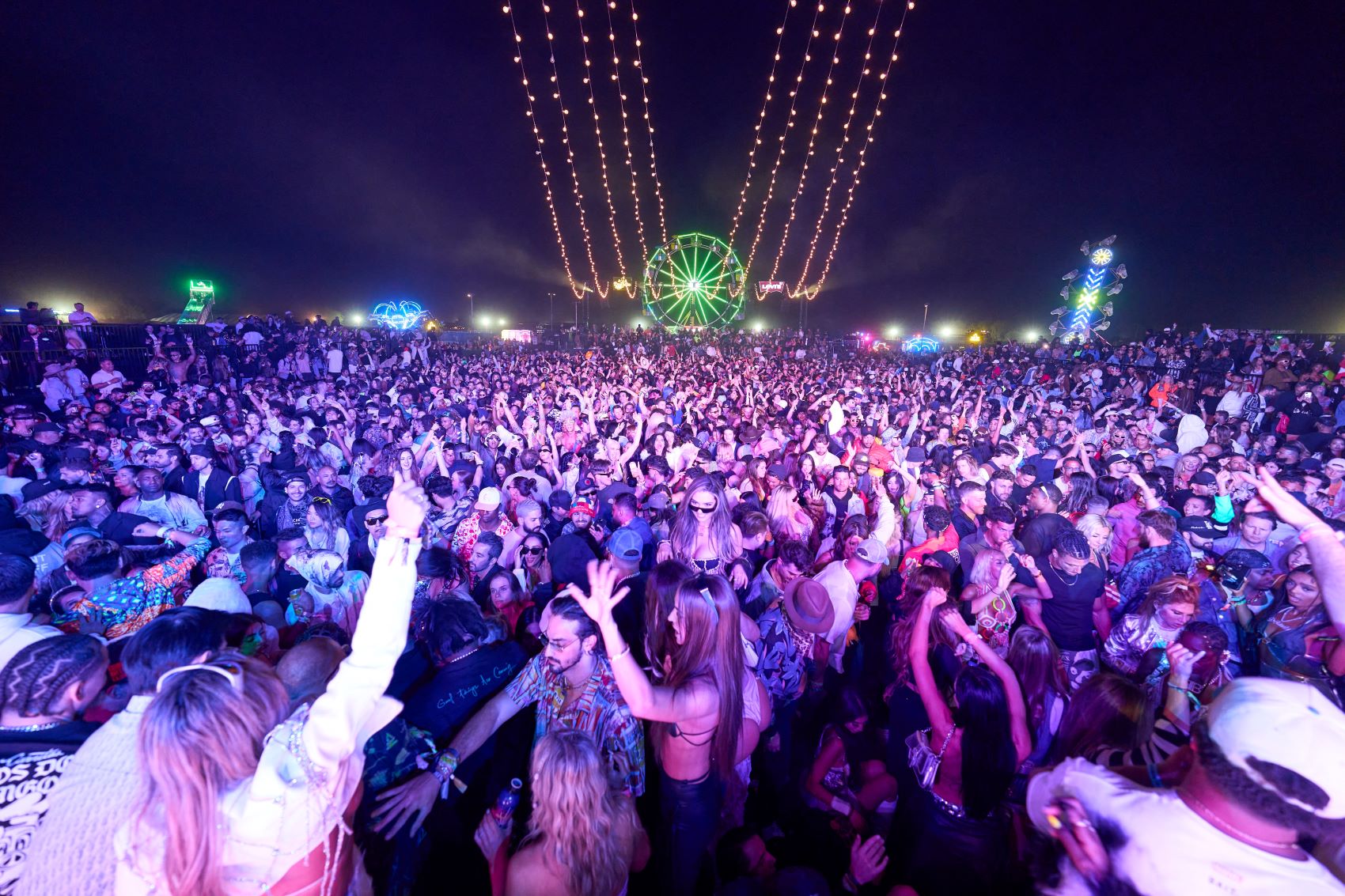 An image of people dancing at Neon Carnival.