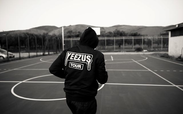 An image of someone wearing a Yeezus sweatshirt from Kanye West's tour.