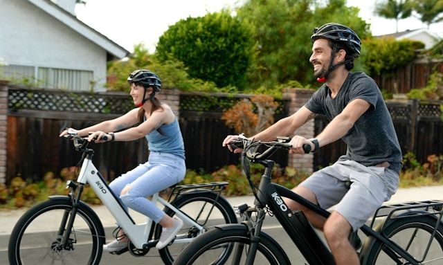 An image of two people riding on bikes.