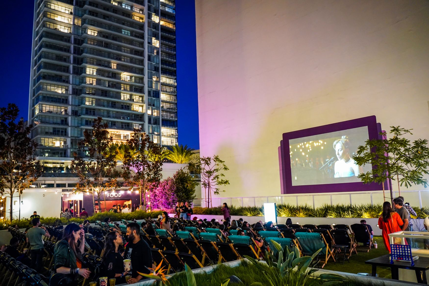 An image of guests watching movies at DTLA Rooftop Cinema Club