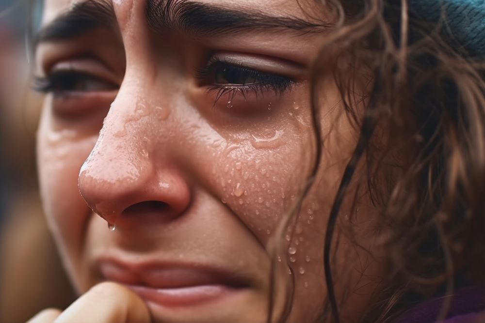 An image of an influencer crying and sharing the lows of her life.