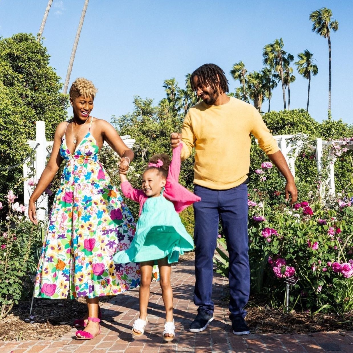 An image of Chef Michael Reed, his wife, and daughter.