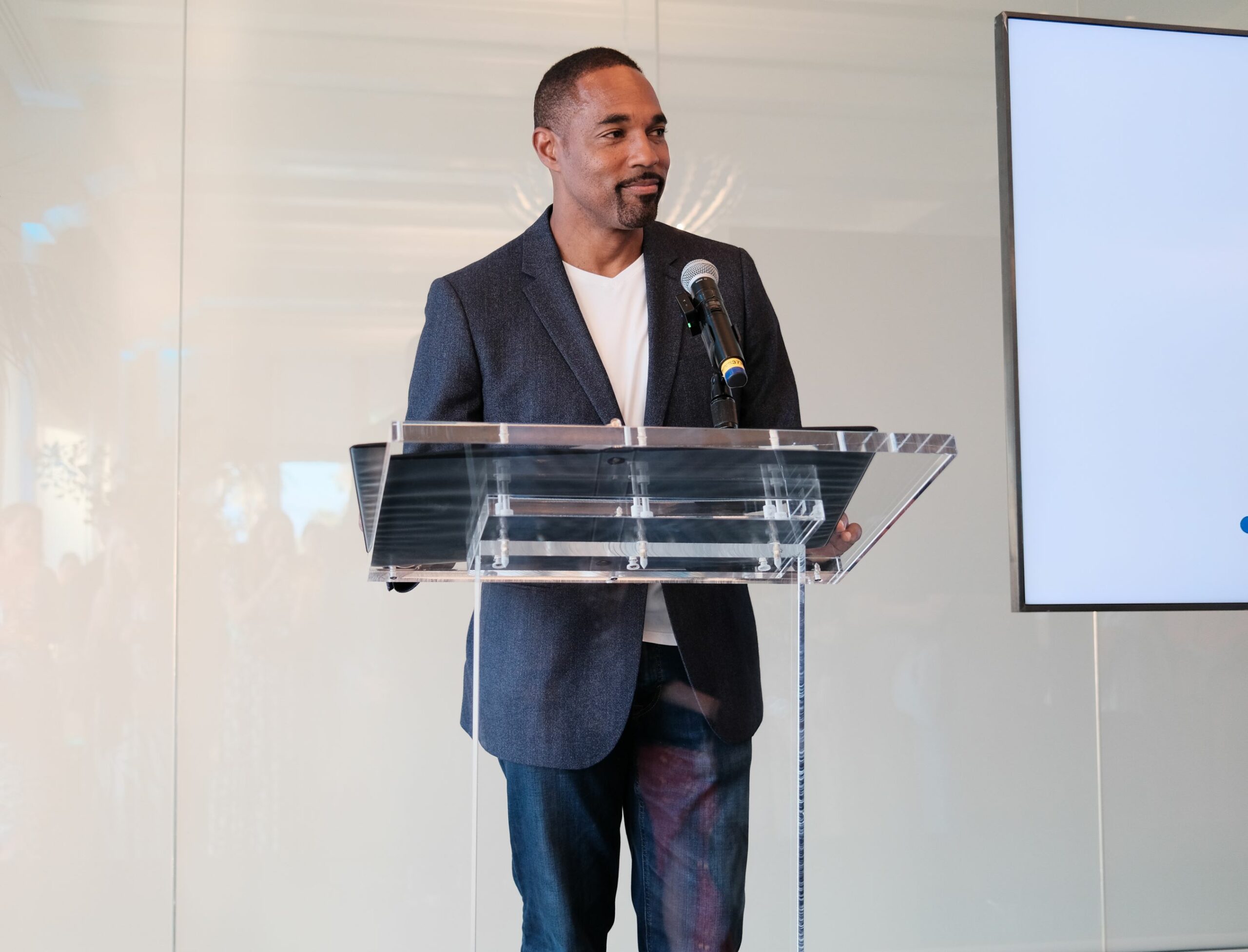 An image of actor Jason George reading an ocean-themed story.