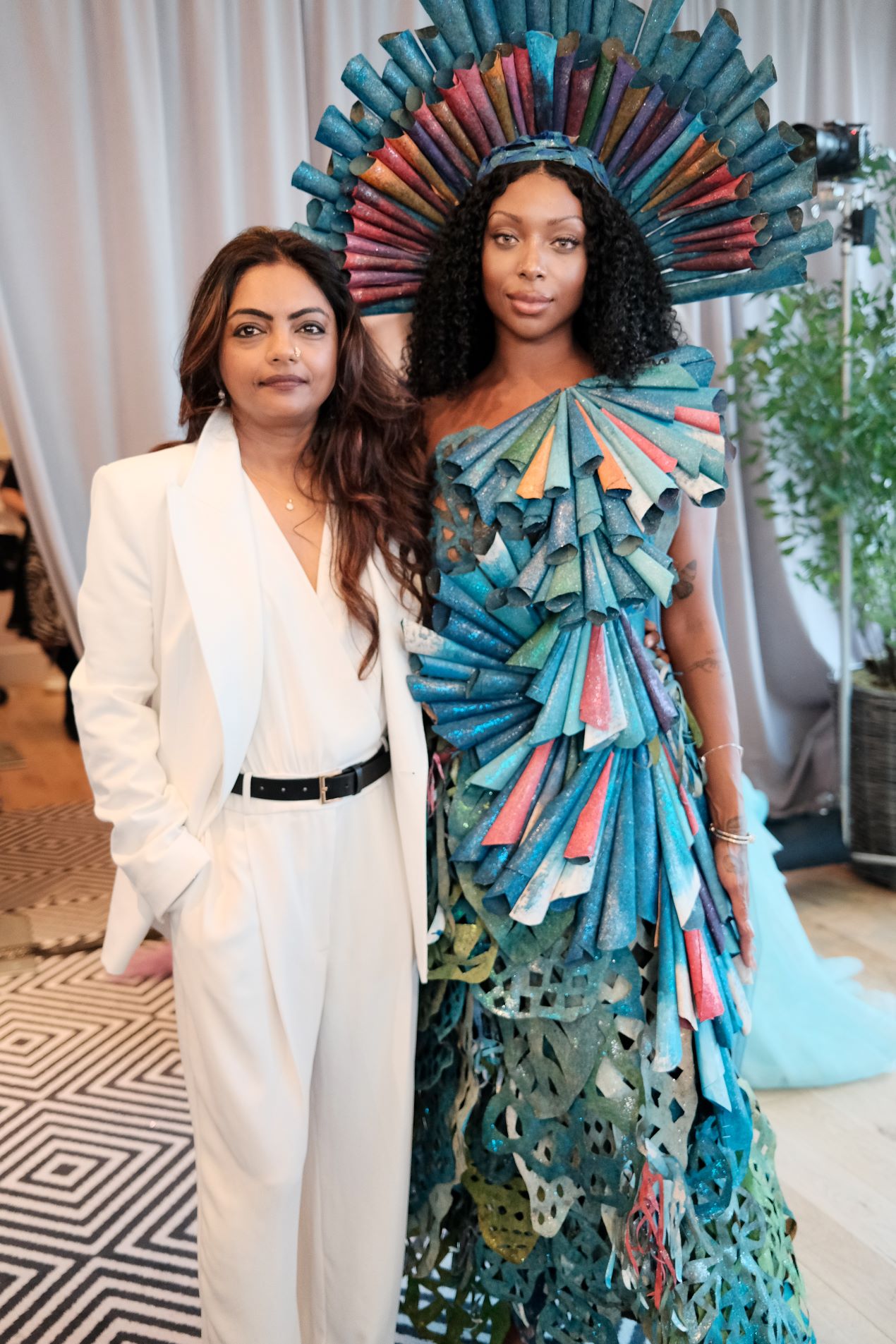 An image of sustainable fashion designer Runa Ray and a model.